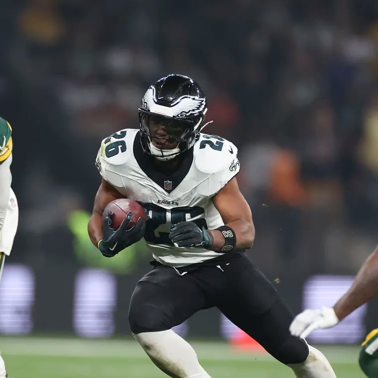 Eagles running back Saquon Barkley finds a seam in the Green Bay Packers defense during the opener in Brazil.