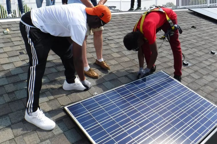 Students from the Philadelphia School District's first solar training program  learn installation at the Navy Yard.