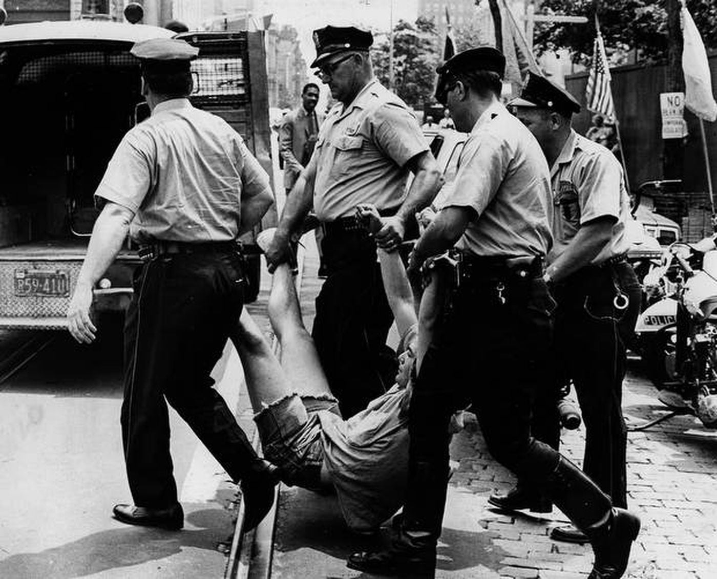 Philadelphia Police carry a protester away from a July 4, 1966 anti-Vietnam War protest held at Independence Hall. A new study proves police are twice as likely to break up a left-wing demonstration than a right-wing one, like Wednesday's storming of the U.S. Capitol.