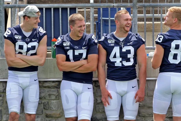 Penn State football tight ends Zack Kuntz (82), Grayson Kline (17), Trevor Baker (43) and Nick Bowers (83) share a laugh last August.