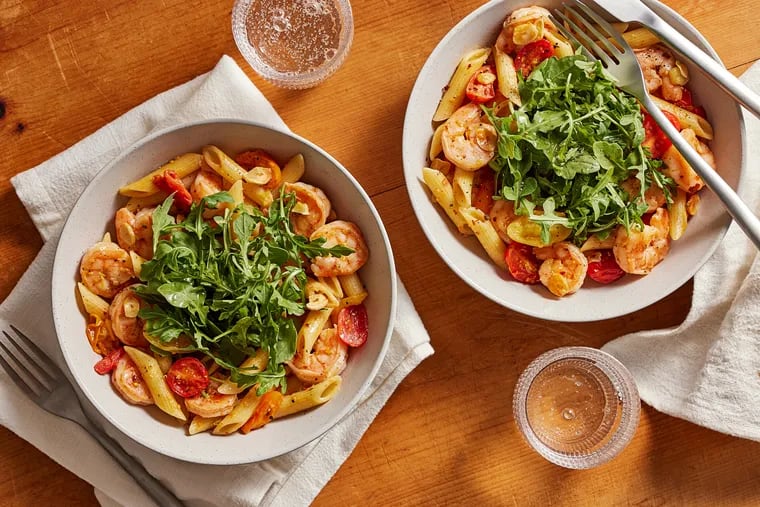 Penne With Shrimp, Toasted Garlic, and Arugula. MUST CREDIT: Tom McCorkle for The Washington Post; food styling by Gina Nistico for The Washington Post