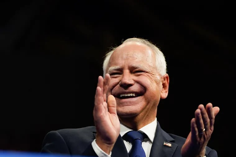 Democratic vice-presidential candidate Minnesota Gov. Tim Walz applauds during a campaign event at Temple University's Liacouras Center in Philadelphia on Aug. 6. Demetrius Freeman/The Washington Post