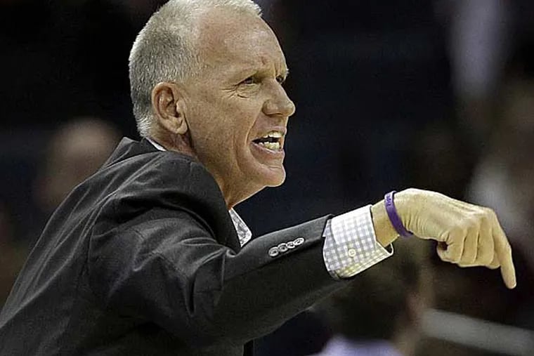 Doug Collins directs his team against the Charlotte Bobcats during the first half of an NBA basketball game in Charlotte, N.C., Friday, Nov. 30, 2012. (Chuck Burton/AP)