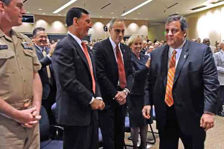 At Lockheed Martin in Moorestown, NJ, Gov. Chris Christie, US Rep Rob Andrews and others celebrate the extension of a huge federal contract on March 28. 2013. Here, from left to right: Captain Joe Dunn, Commanding Officer, for Lockheed Martin Moorestown; US Rep. Frank LoBiondo; Lockheed Martin Integrated Warfare Systems and Sensors VP Carl Bannar; Lt. Gov. Kim Guadagno; and Christie.  ( APRIL SAUL / Staff )