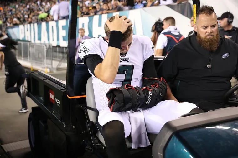 Eagles quarterback Nate Sudfeld is carted off the field after he was injured late in the second quarter Thursday night.