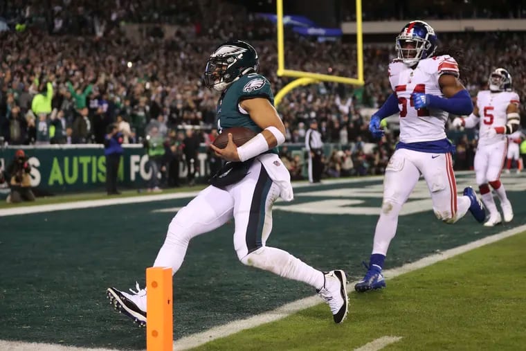 Eagles quarterback Jalen Hurts scoring a touchdown during a playoff rout of the Giants at Lincoln Financial Field on Jan. 21.