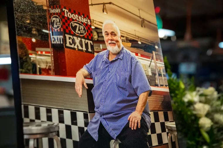A photo of Domenic Spataro, longtime owner of Spataro's Cheesesteaks, hung for a memorial service in Center Court of the Reading Terminal Market.