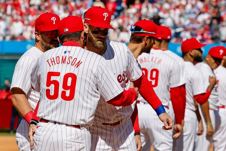 Phillies manager Rob Thomson and first baseman Bryce Harper during introductions on opening day March 29 at Citizens Bank Park.