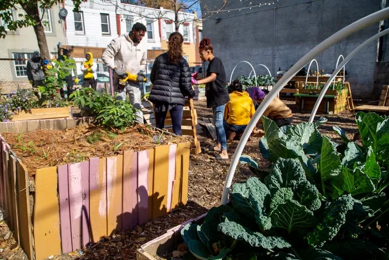 Participants in the Klean Kensington program build flower beds from wooden skids last month. "These kids are yearning for an opportunity," writes Jeremy Chen, the program's organizer.