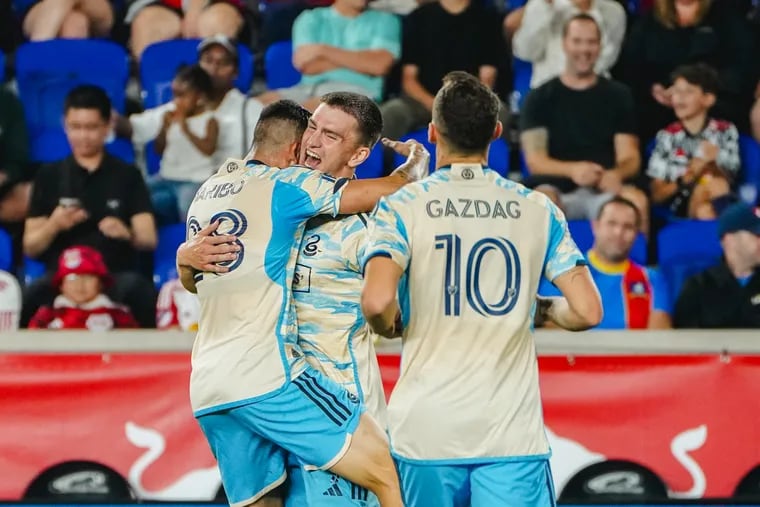 Mikael Uhre (center) celebrates with Tai Baribo (left) and Dániel Gazdag (right) after one of the Union's goals against the Red Bulls on Saturday.