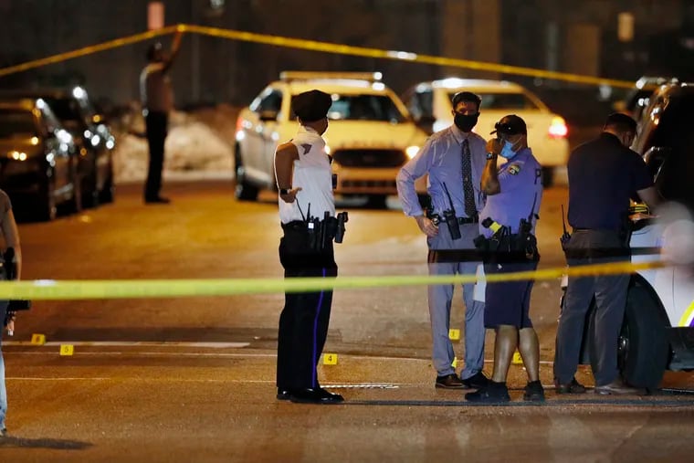 Police investigate the scene around 38th and Poplar Streets, by the Clayborn Lewis Community Center Playground, where six people were shot just before 9:30 p.m. Saturday. A half hour later an 11-year-old boy became the 101st kid shot in the city this year, sustaining a graze wound to the head and shoulder near Olney Playground.