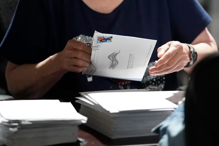 An election worker in Mercer, Pa. counts ballots for the Pennsylvania primary in May.