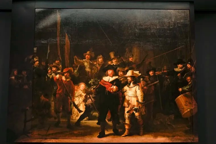 View of Rembrandt's biggest painting the Night Watch which just got bigger with the help of artificial intelligence, see added sides, in Amsterdam, Netherlands, Wednesday, June 23, 2021. The Dutch national museum and art gallery Rijksmuseum reveals findings from a long-term project to examine in minute detail Rembrandt van Rijn's masterpiece the Night Watch. (AP Photo/Peter Dejong)
