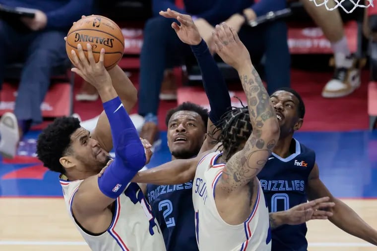 Tobias Harris, who led the Sixers with 21 points, and Mike Scott scramble for a rebound in the second quarter against the Memphis Grizzlies.