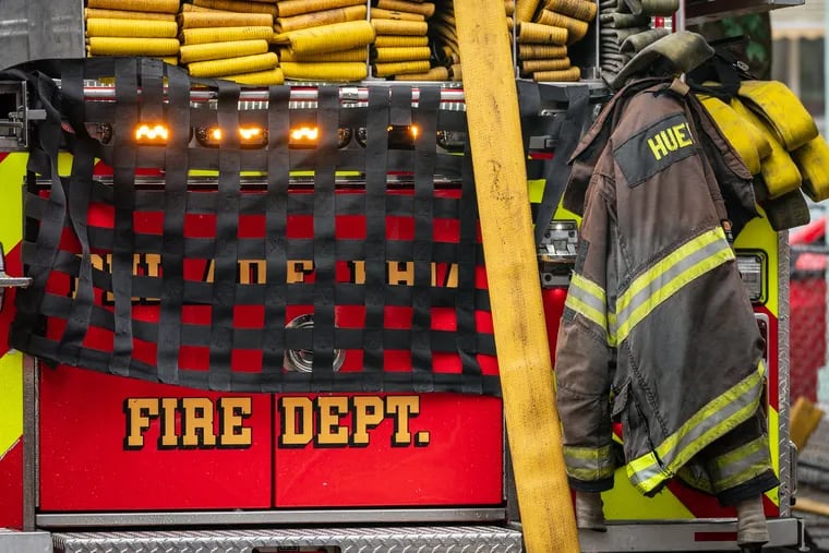 Turnout gear on the back of a fire truck at an all hands fire in June 2023.