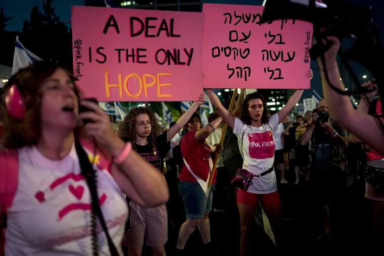 Activists and relatives of hostages held by Hamas militants in the Gaza Strip call for their immediate release and protest against Israeli Prime Minister Benjamin Netanyahu's government, in Tel Aviv, Israel, on Saturday.