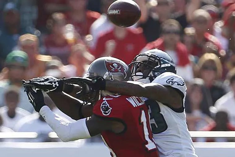 Dominique Rodgers-Cromartie knocks a pass intended to Bucs WR Mike Williams. (Ron Cortes/Staff Photographer)