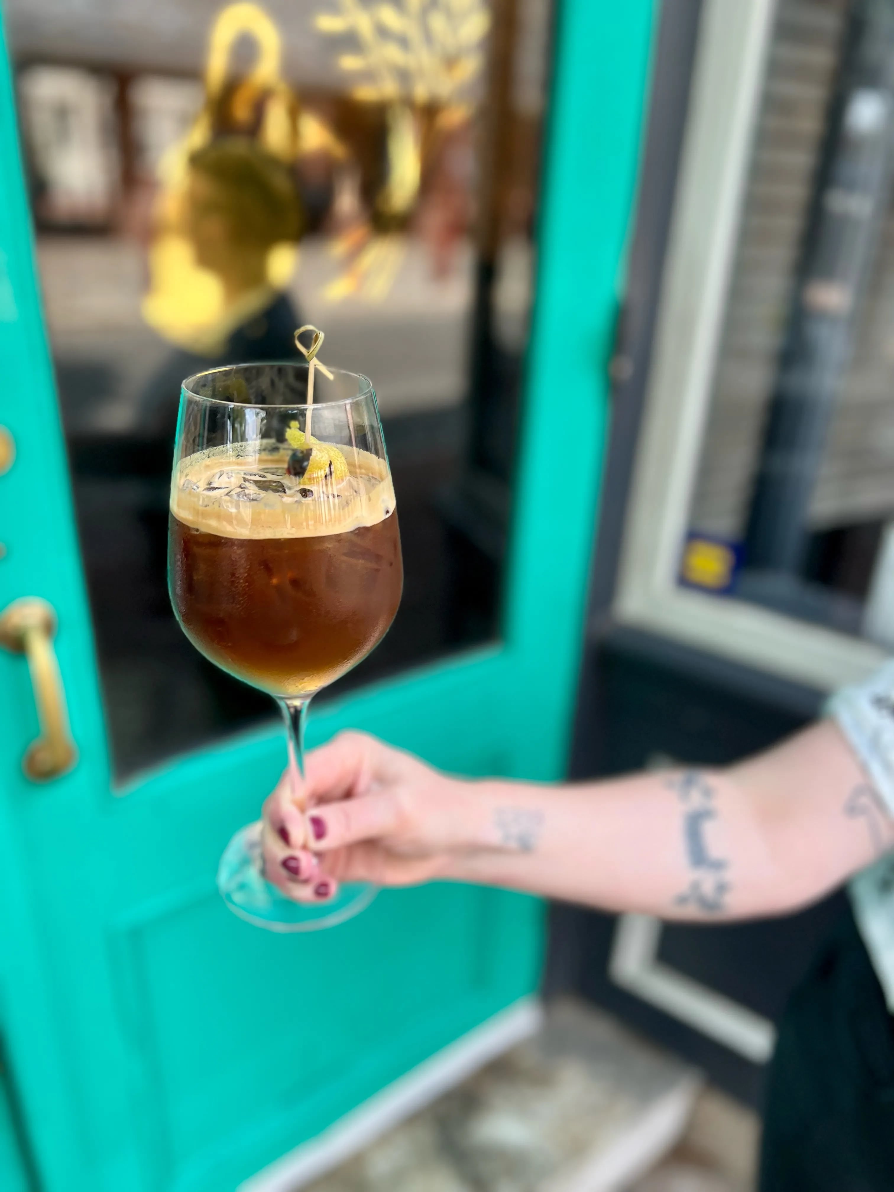 There's an espresso tonic in a wine glass at Bloomsday Cafe.