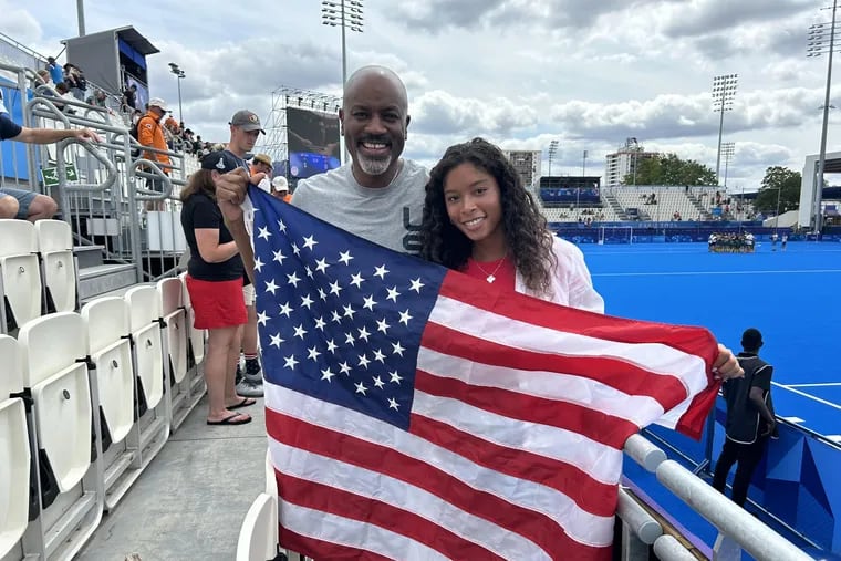 Former Sixers president Billy King and his daughter Natane celebrate the United States' 1-0 victory over South Africa on Saturday at the Summer Olympics.