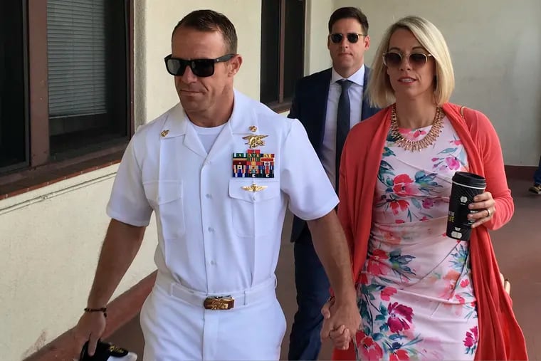 Navy Special Operations Chief Edward Gallagher walks with his wife, Andrea Gallagher, as they arrive at military court on Naval Base San Diego, Monday, July 1, 2019, in San Diego.