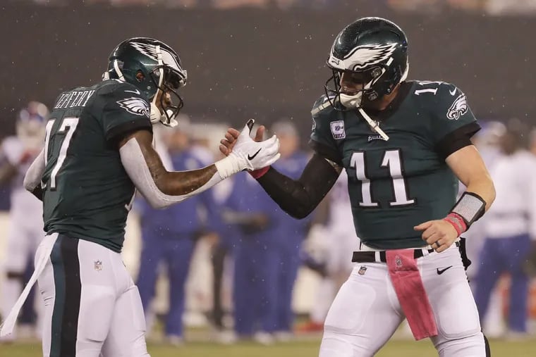 Eagles wide receiver Alshon Jeffery and quarterback Carson Wentz celebrate Jeffery's first quarter touchdown against the New York Giants on Thursday, October 11, 2018 in East Rutherford, NJ. YONG KIM / Staff Photographer