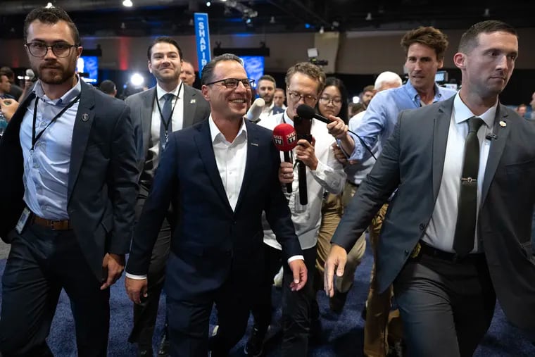 Gov. Josh Shapiro arrives in the spin room at the Pennsylvania Convention Center following the debate between former President Donald Trump and Vice President Kamala Harris on Tuesday in Philadelphia.