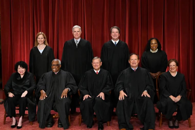 Justices of the U.S. Supreme Court pose for their official photo at the Supreme Court in Washington, D.C., on Oct. 7, 2022. (Olivier Douliery/AFP via Getty Images/TNS)