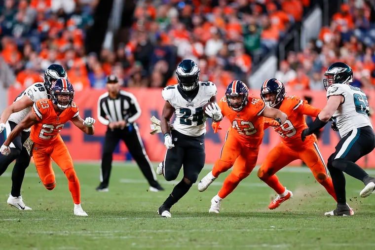 Eagles running back Jordan Howard runs with the football past the Denver Broncos defense during the fourth quarter on Sunday, November 14, 2021 in Denver.