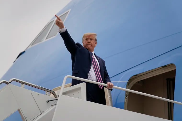 President Donald Trump boards Air Force One for a trip to Phoenix to visit a Honeywell plant that manufactures protective equipment.