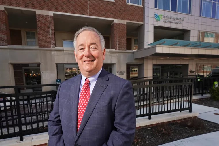 Jack Lynch, shown here outside Bryn Mawr Hospital in 2022, will retire as the CEO of Main Line Health next June.