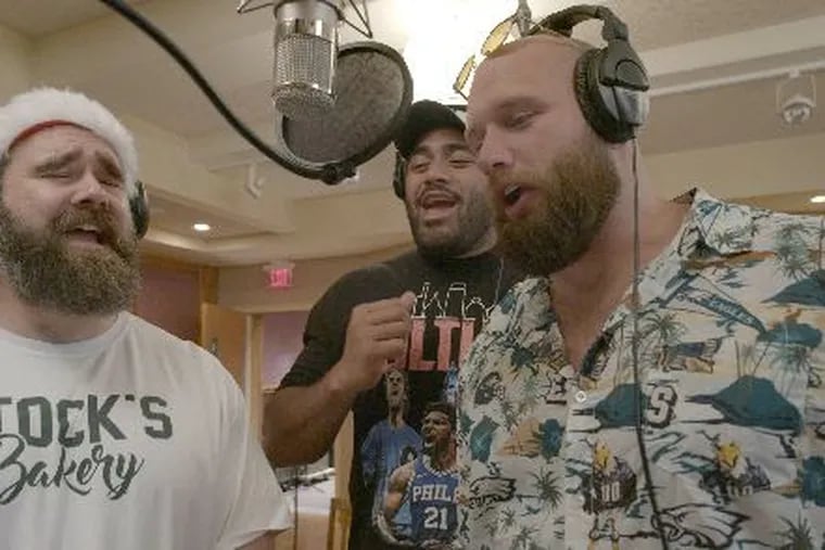 Eagles linemen Jason Kelce (from left), Jordan Mailata, and Lane Johnson are back with another holiday album. The album will benefit CHOP and CCTC.