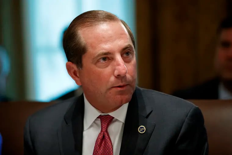 In this Tuesday, July 16, 2019, file photo, Health and Human Services Secretary Alex Azar pauses while speaking during a Cabinet meeting at the White House, in Washington. Azar says he and President Donald Trump are working on a plan to allow Americans to import lower-priced prescription drugs from Canada.