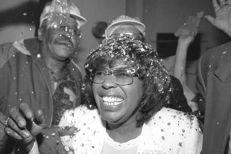 Former City Councilmember Donna Reed Miller celebrates her victory in the 2011 election.