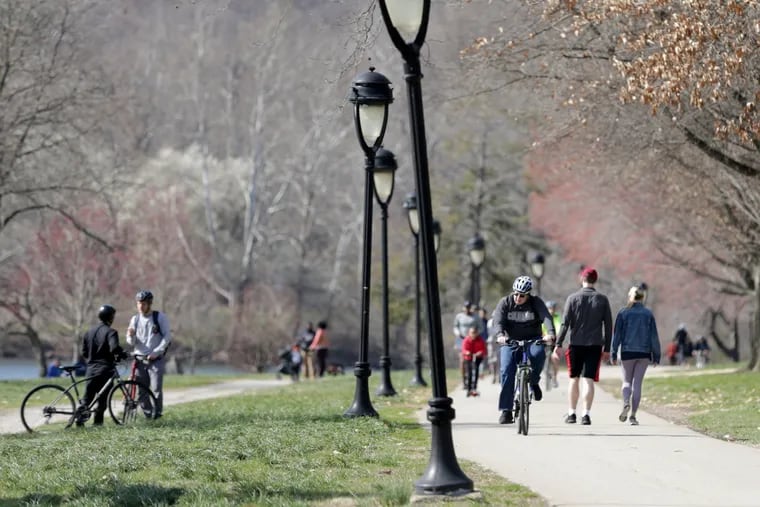 People took to Kelly Drive to get out and exercise as the temperature climbed to 60 in Philadelphia, PA on Wednesday, March 18, 2020. The social distancing standard of six feet  due to the spread of the coronavirus didn’t appear to stop people from gathering.