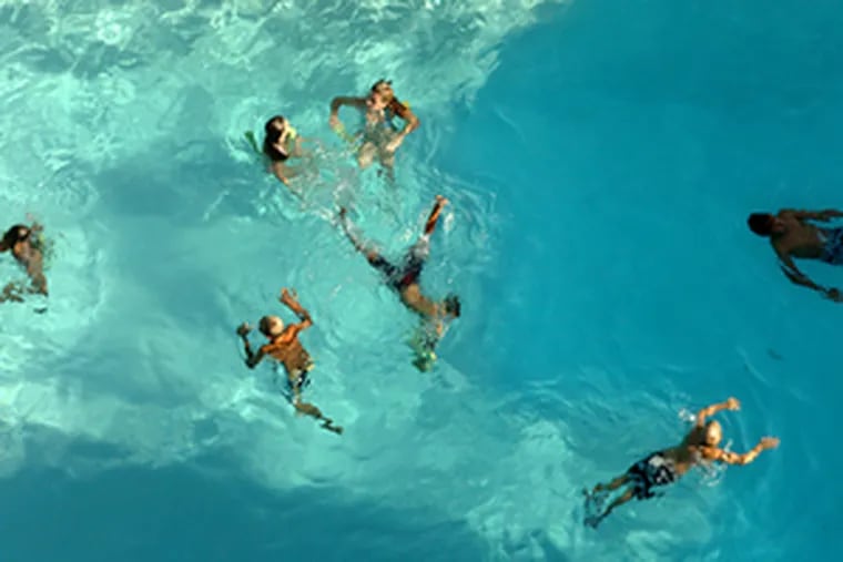 Guests at the Atlas Inn in Cape May make the most of the last weekend of the traditional Shore season with a swim in the hotel pool. More pleasant weather is expected today for Labor Day, with increasing clouds and humidity but no rain.