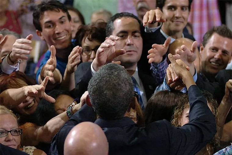 President Obama receives a show of hands to shake after his speech at  Lackawanna College. (AP  / Scranton Times-Tribune, Butch Comegys)