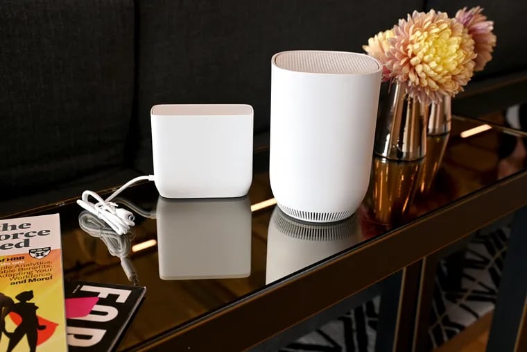 The Storm-Ready WiFi device (right) with the power-supply and battery backup (left) on display at the Comcast Technology Center’s Product Experience Center Tuesday, Oct. 10, 2023.