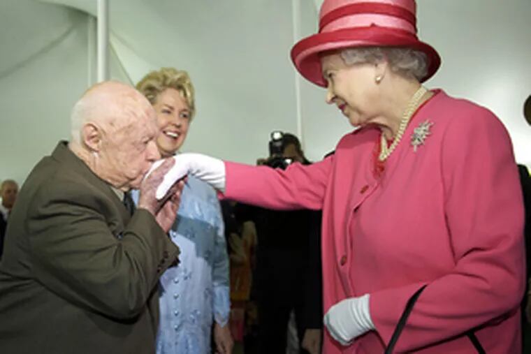 Actor Mickey Rooney kissed the hand of Queen Elizabeth II during a garden party at the British Embassy yesterday. The royal couple were staying at Blair House.