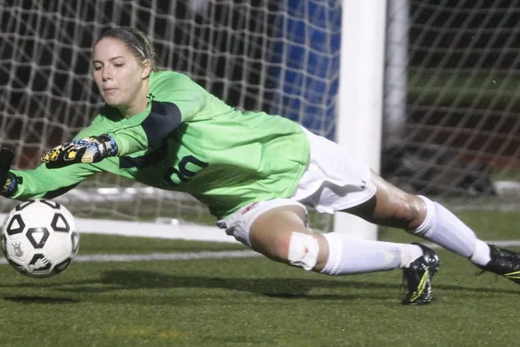Jordynn Stallard of Washington Twp.makes a diving stop against Shawnee in the 2nd half of the semifinals of South Jersey Coaches Association Tournament in girls' soccer at Paul VI on Oct. 27, 2016. CHARLES FOX / Staff Photographer