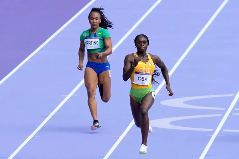 Jessika Gbai (right), a North Philly native who represented Cote d’Ivoire, finished eighth in the Olympic 200-meter final.