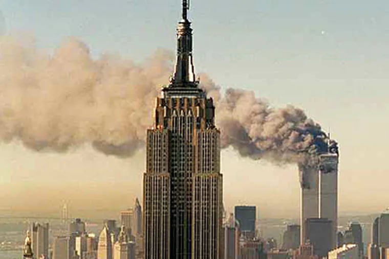 The twin towers of the World Trade Center burn in this file photo from Sept. 11, 2001. (Associated Press)