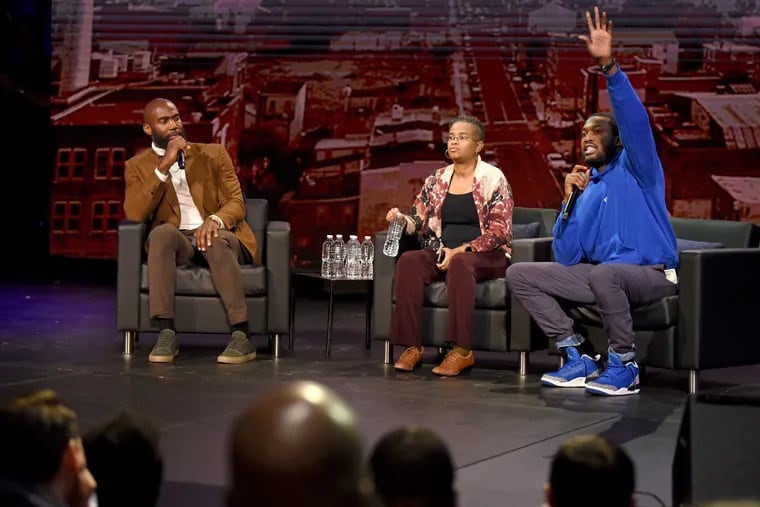 The NFL Players Coalition, a nonprofit co-founded by Eagles Malcolm Jenkins (left), hosts a public forum with rapper Meek Mill (right) and Rev. Leslie D. Callahan (center), pastor at St. Paul's Baptist Church, at Community College of Philadelphia last month about the hiring of a new police commissioner.