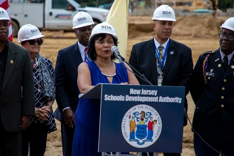 In this file photo, Camden School board president Martha Wilson, participates in a groundbreaking new school construction ceremony with a few current students from Camden High School.