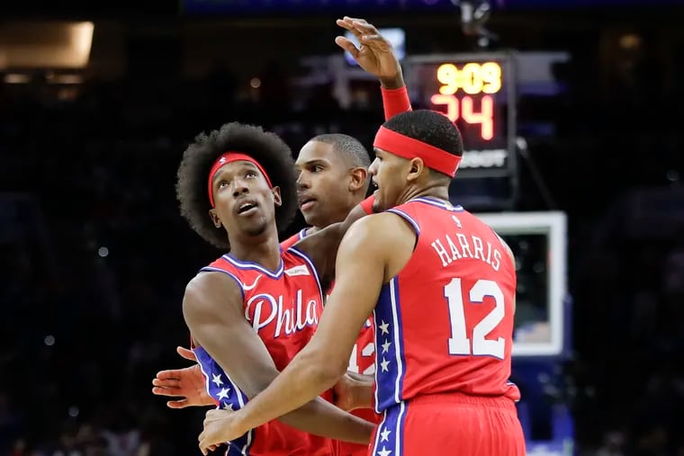 Josh Richardson (left) celebrating a three-pointer with Al Horford and Tobias Harris during a November game against the Miami Heat.