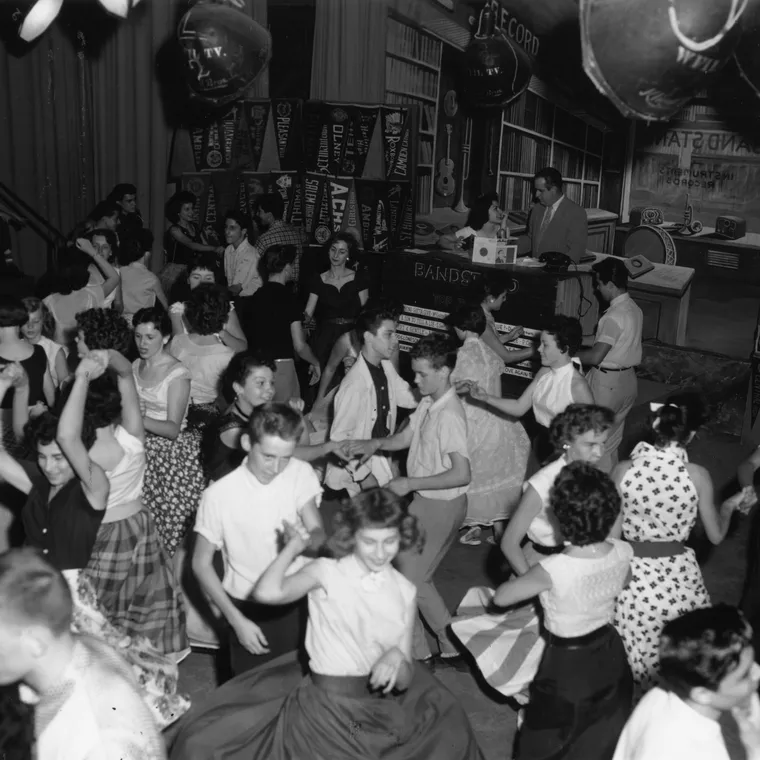 Teenagers dancing on the television show 'Bandstand' in July 1955. Bob Horn, host, talks to a young woman in the background.