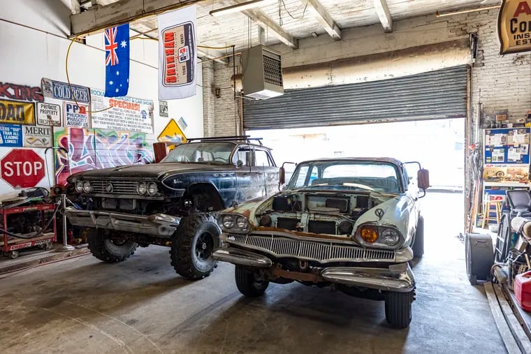 A 1961 Buick on a 4x4 chassis (left) and a 1960 Dodge Dart Seneca that Brian Smith worked on in the beginning of 2020 at the No Kill Car Shelter.