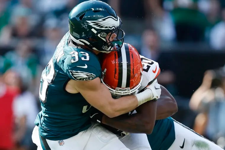 Eagles cornerback Cooper DeJean makes a stop on Cleveland Browns running back Pierre Strong Jr. during Sunday's win.