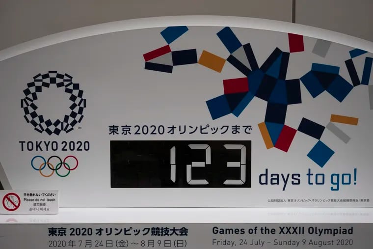 A countdown clock for the Tokyo 2020 Olympics is photographed in Tokyo on Monday, one day before the Games were officially postponed until next year.