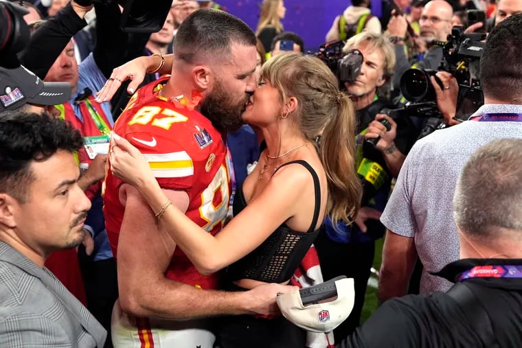 Taylor Swift kisses Kansas City Chiefs tight end Travis Kelce after the NFL Super Bowl 58 football game against the San Francisco 49ers Feb. 11 in Las Vegas. The Chiefs won 25-22.