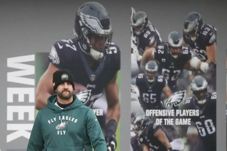 Philadelphia Eagles head coach Nick Sirianni looks on as photos of his team are behind him during practice at the NovaCare Complex in Philadelphia on Thursday.